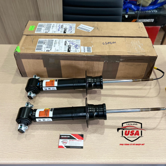 Phuộc nhúng trước Cadillac Ascalade 