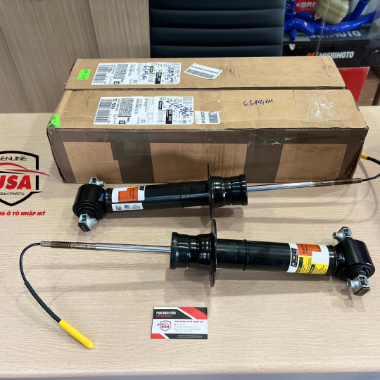 Phuộc nhúng trước Cadillac Ascalade 