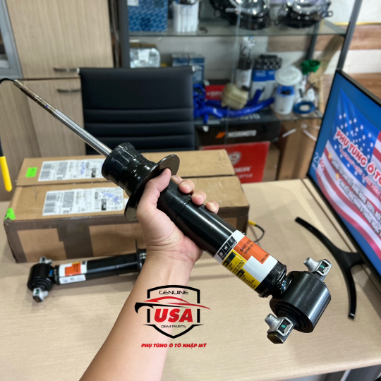 Phuộc nhúng trước Cadillac Ascalade 
