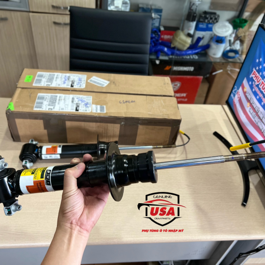 Phuộc nhúng trước Cadillac Ascalade 